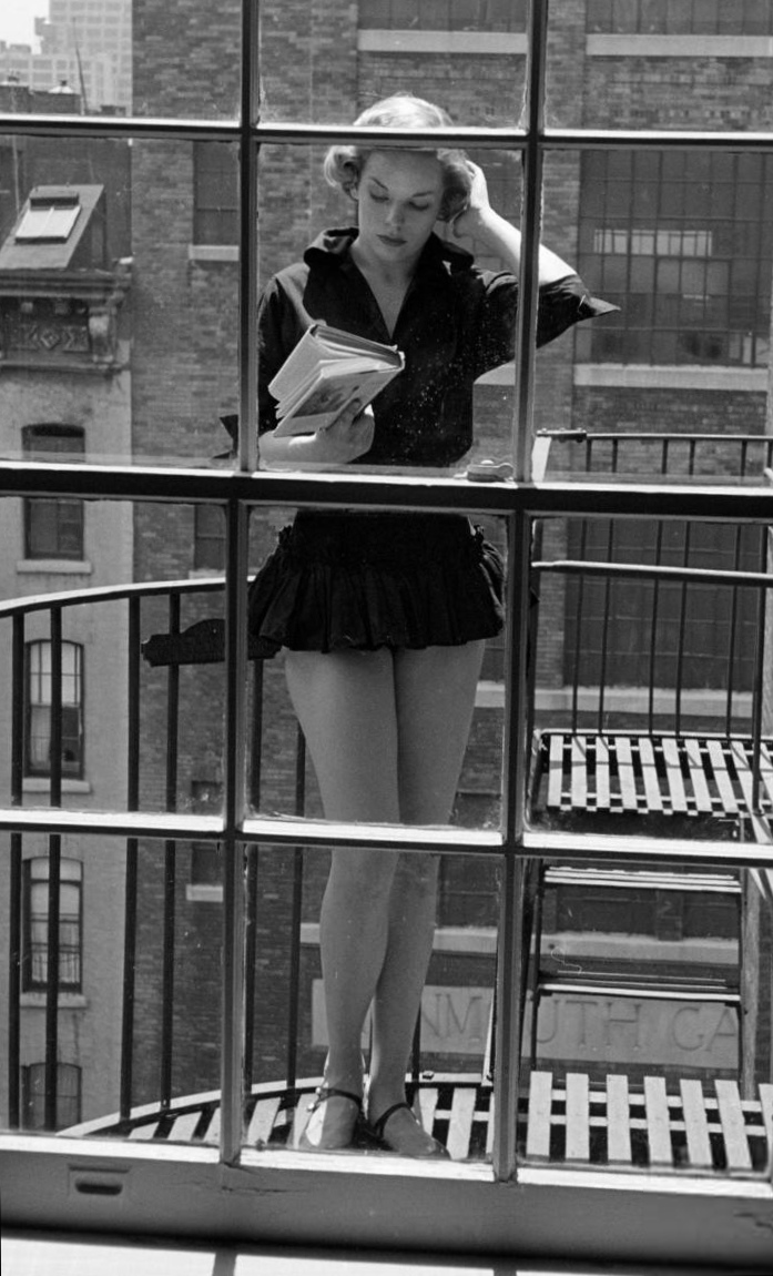 City Reading On Balcony Model Unknown Date Unknown NSF