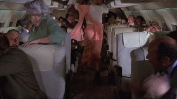 Kitten Natividad Breasts Scene In Airplane NSFW