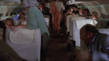 Kitten Natividad Breasts Scene In Airplane NSFW