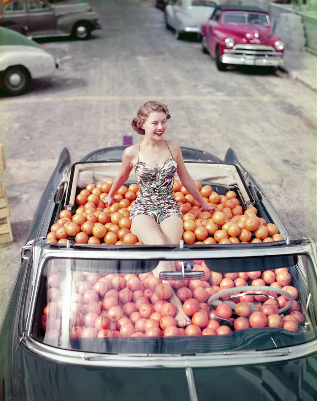 Swimsuit Model In A Cadillac Convertible Filled With Oranges Ca 1951 NSF